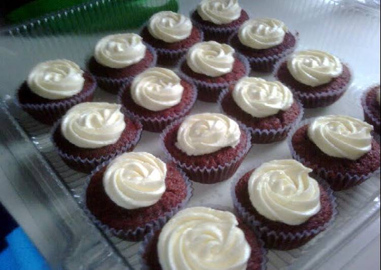 delicious red velvet cupcakes topped with creamy cream cheese