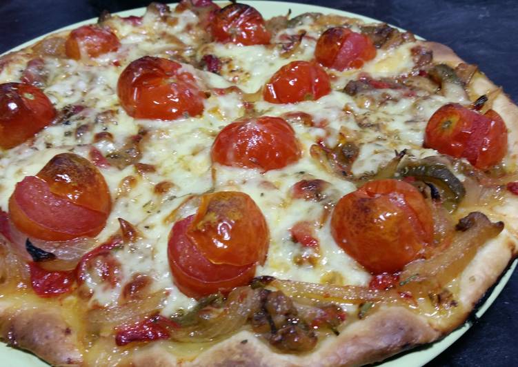 Vegetarian pizza with roasted peppers and cherry tomatoes