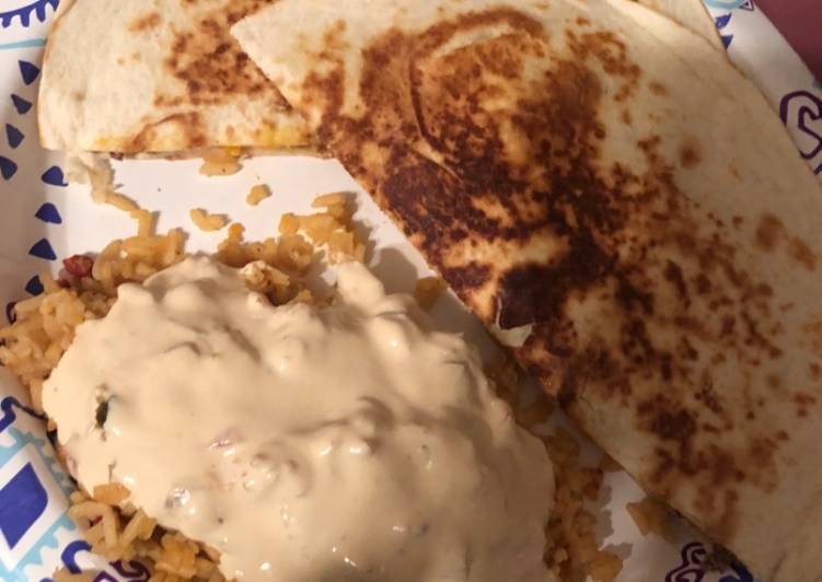 Nacho quesadillas and queso covered Spanish rice