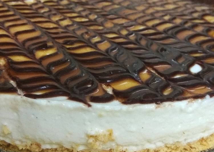 Vanilla cheesecake topped with chocolate and caramel