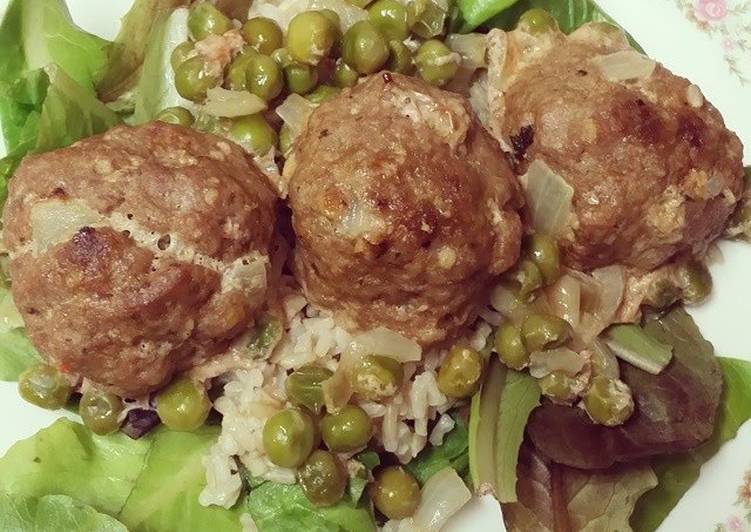 Turkey Meatballs w/ brown rice & peas over a bed of mixed greens