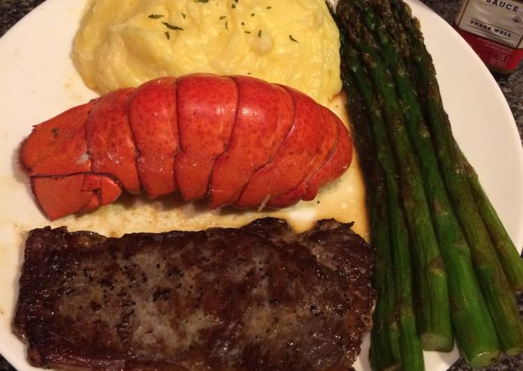 Thin cut New York strip with lobster and asparagus