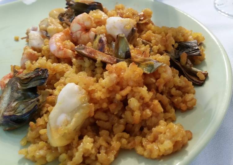 Seafood paella with artichokes