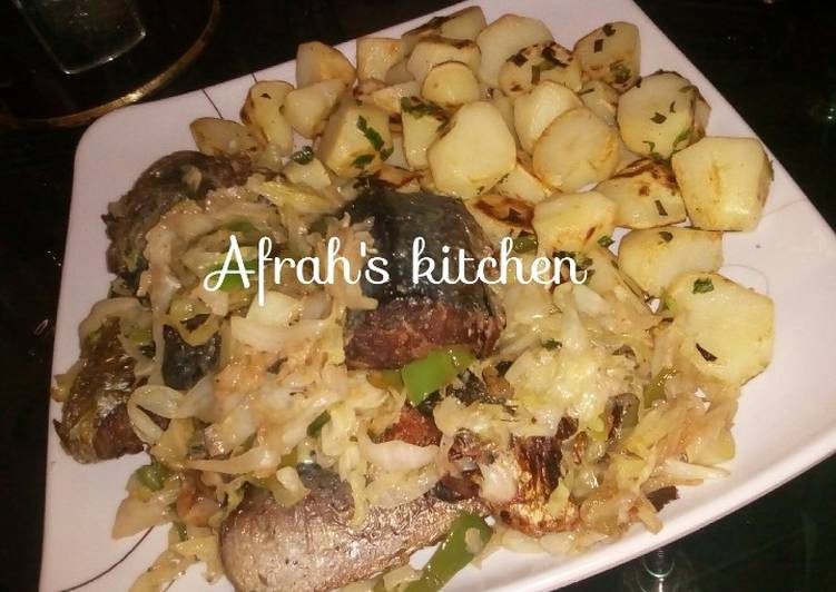 Baked potatoes and oven fish with cabbage sauce