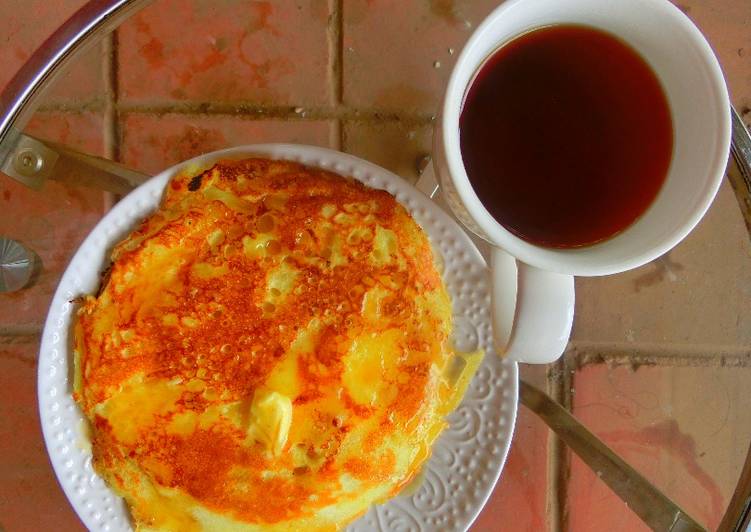 Pancake, butter and hot tea
