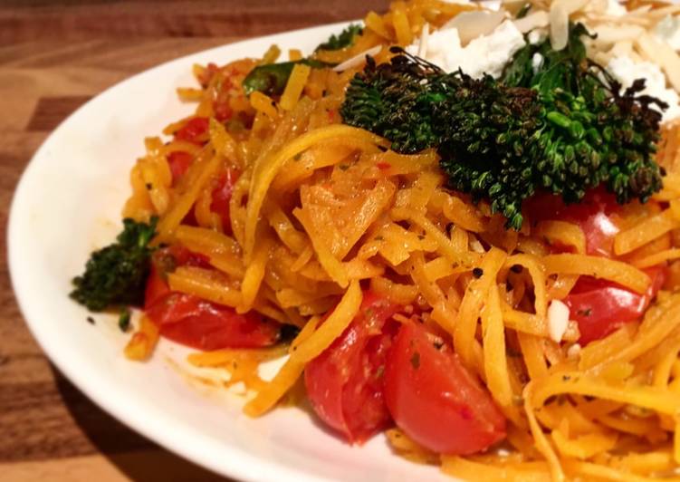 Butternut squash zoodles stir fry in spicy thai sauce, cherry tomatoes, broccolini, feta